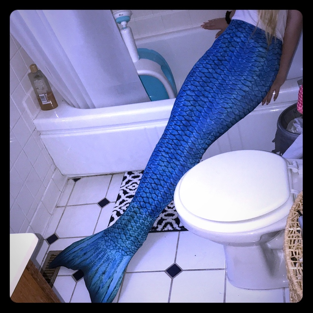 Blue mermaid tail and monofin for swimming